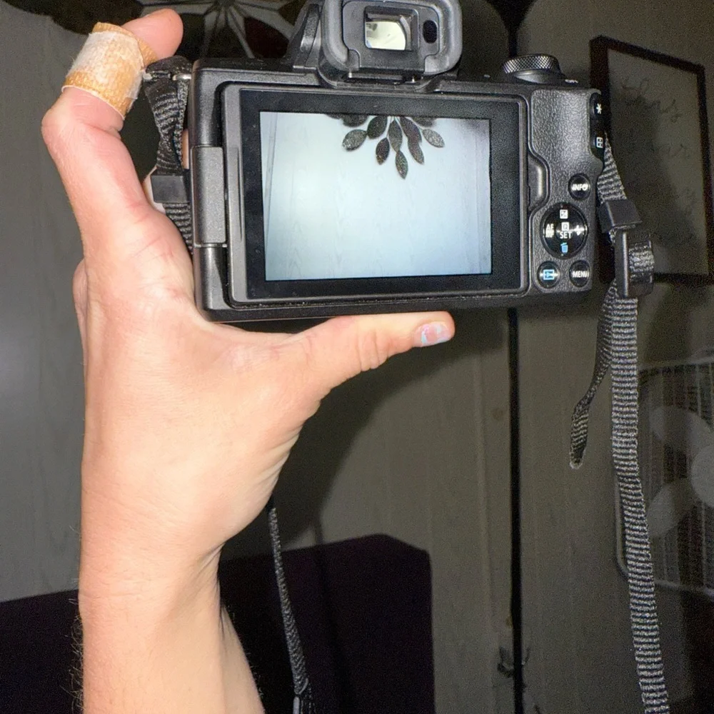 Canon Black DSLR Camera with Strap